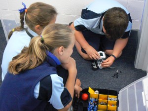 students playing with LEGO