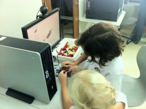 A pair of students sharing one WeDo kit.